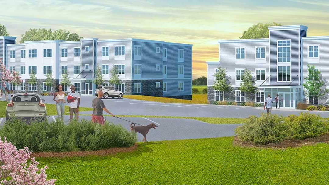 Two new 3 story apartment buildings with beautiful landscaping.