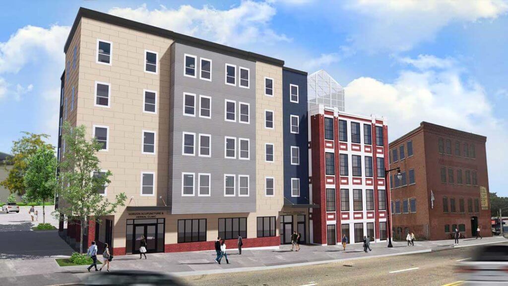 Modern 5 story building with street level commercial space.